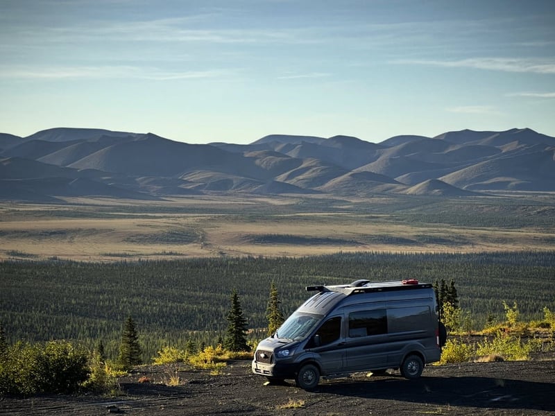 Boondocking in a gravel pit with mountain views on the Dempster Highway