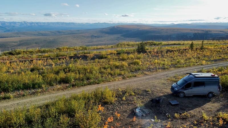 Aerial drone shot of boondocking near a microwave tower on the Dempster Highway