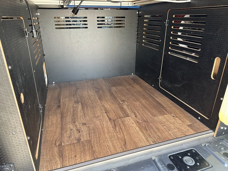 The rear garage with plywood divider, empty