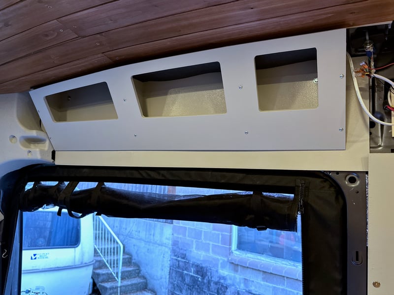 The angled open cubby above the sliding door